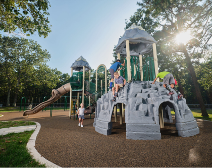 Playground in park with rock climbing.