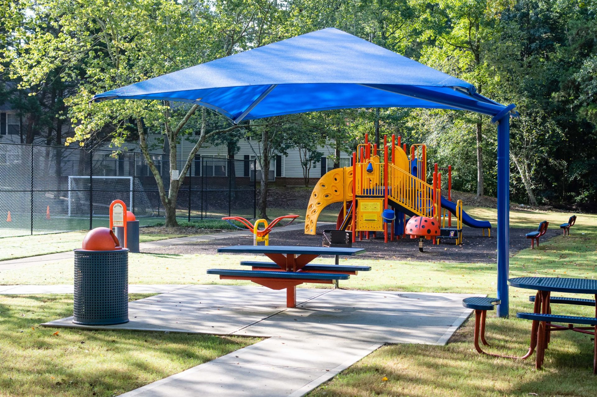 Brookstone playground with picinic tables and shade structure
